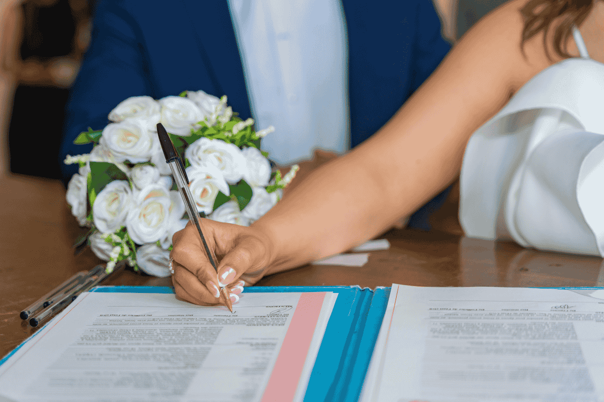 A couple signing a certificate of no impediment